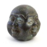 An Oriental cast bronze modelled as the four faces of Buddha. Character marks to base. Approx. 3 1/
