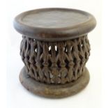 Ethnographic / Native / Tribal: A carved African stool circular top and base. Approx. 18" high x 20"