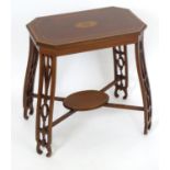 An early 20thC mahogany side table by Cornelius V Smith with an octagonal top having decorative