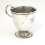 A silver christening mug, hallmarked London1915, maker Mappin & Webb. 3" high Please Note - we do