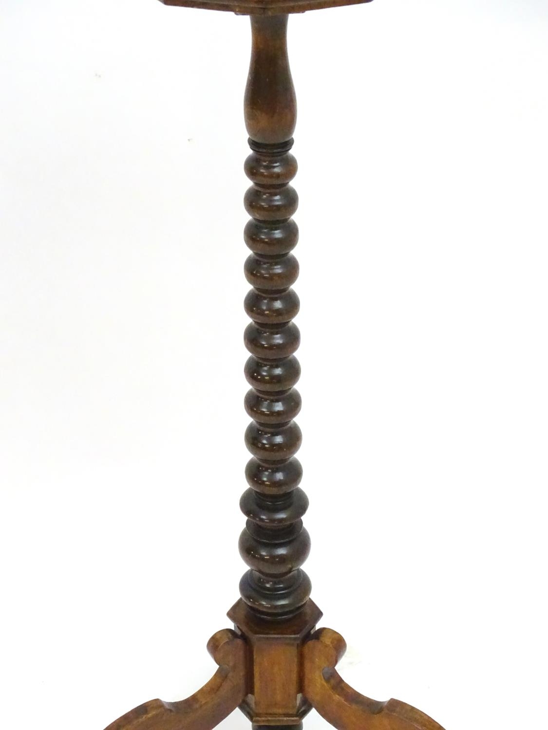 A 17thC and later walnut candle stand with a crossbanded top above a bobbin turned stem and three - Image 2 of 7