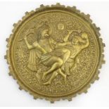 A 20thC Indian brass tray / charger with embossed decoration depicting the battle between the