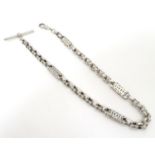 A late 19thC silver watch chain. Approx. 14 1/2" long. Please Note - we do not make reference to the