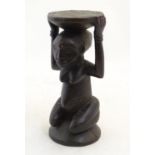 Ethnographic / Native / Tribal: A carved African small stool / stand of figural form. Approx. 10"