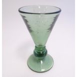 A green glass of conical form with top to stem and fleck detail. Indistinctly signed Signed under. 6