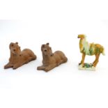 Two Oriental terracotta models of horses, together with a Chinese model of a Tang style horse.