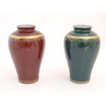 A matched pair of Oriental vases with gilt banded detail. Character marks under. Approx. 9 1/2" high