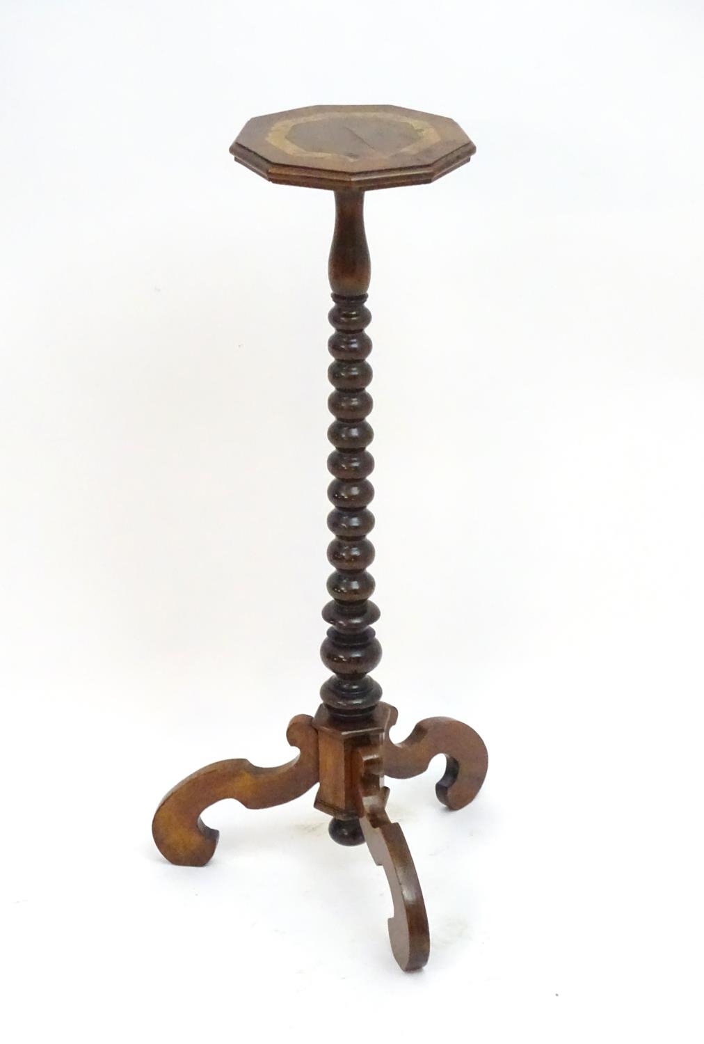 A 17thC and later walnut candle stand with a crossbanded top above a bobbin turned stem and three - Image 6 of 7