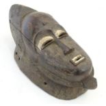 Ethnographic / Native / Tribal: A Nigerian mask with carved detail. Approx. 15 1/2" long Please Note