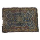 Carpet / Rug : A blue ground rug with central medallion motif with geometric detail and borders.