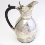 A silver hot water jug hallmarked London 1900 maker Josiah Williams & Co (George Maudsley