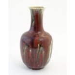 An Oriental high fired sang de boeuf baluster vase. Approx. 12" high Please Note - we do not make