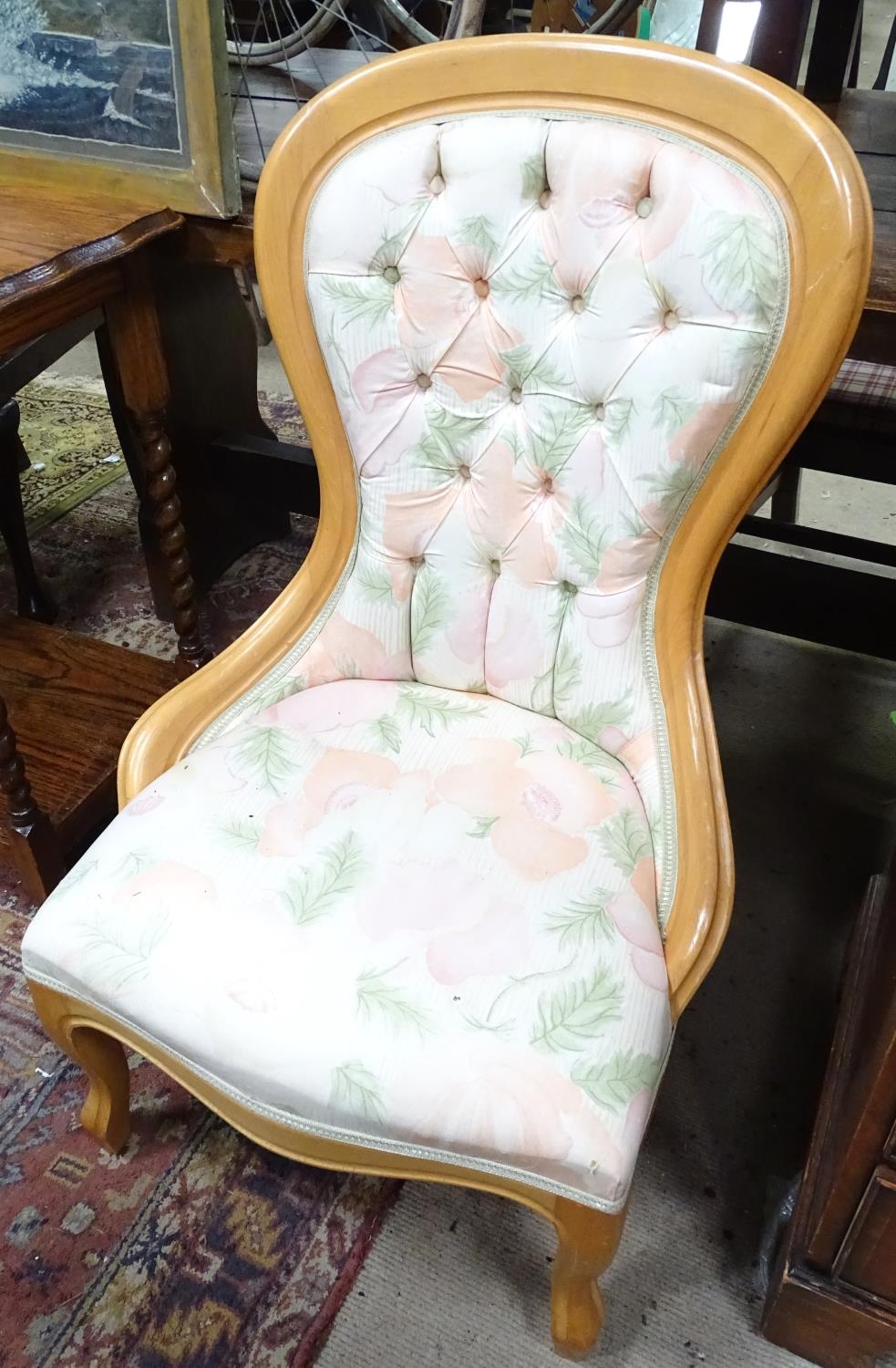 A spoon back chair with button upholstery. Approx. 38 1/2" tall Please Note - we do not make