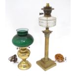 An early 20thC table oil lamp converted to electricity with a Corinthian column brass base. Together