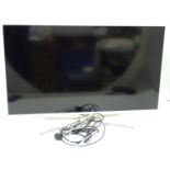 A Samsung flatscreen television / TV Please Note - we do not make reference to the condition of lots