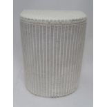 A Lloyd Loom linen basket Please Note - we do not make reference to the condition of lots within