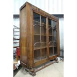 An early 20thC glazed bookcase Please Note - we do not make reference to the condition of lots