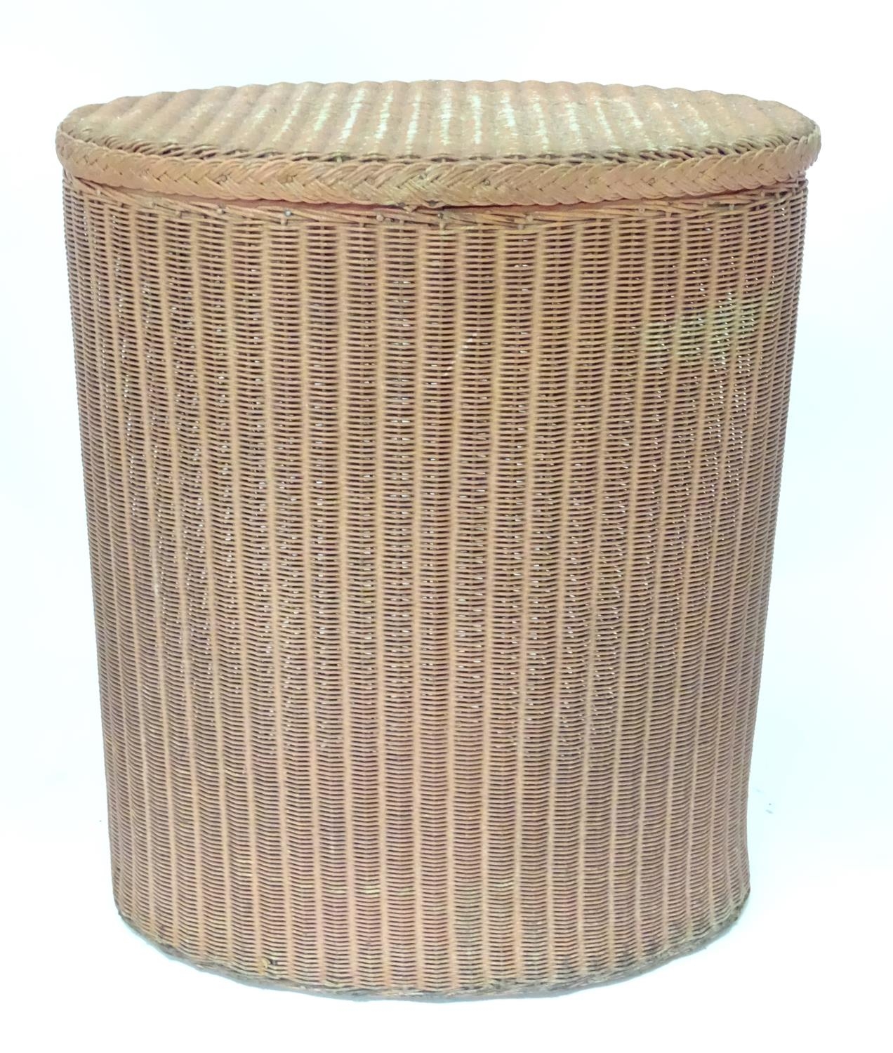 A Lloyd Loom style linen basket of oval form Please Note - we do not make reference to the condition