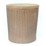 A Lloyd Loom style linen basket of oval form Please Note - we do not make reference to the condition