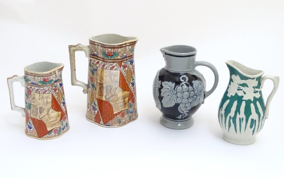 Four assorted jugs, two of quatrefoil form with transfer decoration of panelled flower and sepia