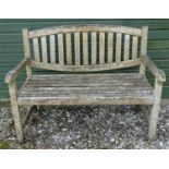 A teak two seater bench Please Note - we do not make reference to the condition of lots within