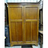 An early 20thC oak wardrobe Please Note - we do not make reference to the condition of lots within