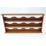 A small wooden rack for collectable items Please Note - we do not make reference to the condition of