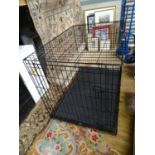 A large folding dog crate Please Note - we do not make reference to the condition of lots within