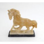 A soapstone model of a horse Please Note - we do not make reference to the condition of lots