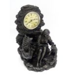 A figural mantel clock with wolves and Native American decoration with a quartz movement Please Note
