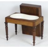 A Georgian mahogany bidet with a rectangular lid above four turned tapering legs. 22" wide x 14"