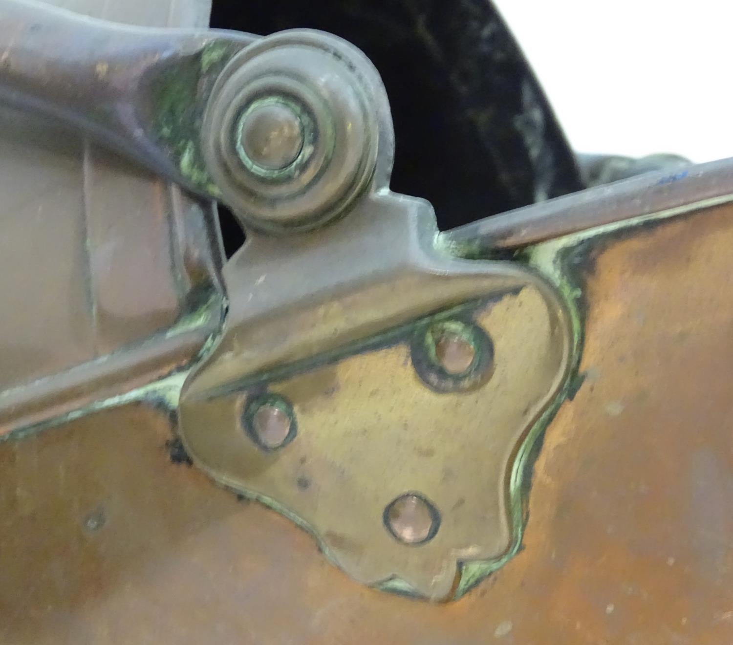 An assortment of brass and copper items, comprising a large stove pan, a helmet coal scuttle, a - Image 8 of 10