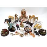 A quantity of dog figurines Please Note - we do not make reference to the condition of lots within