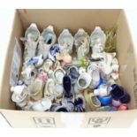 A large quantity of novelty ceramic shoes to include Delft clogs, etc. Please Note - we do not