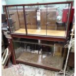 A pair of mahogany glazed and brass reinforced shop display cabinets (2) Please Note - we do not