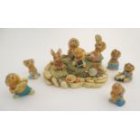 A quantity of Pendelfin rabbit figures and display stand. Tallest figure approx. 4" high. (10)