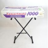 A Concertmate keyboard and stand Please Note - we do not make reference to the condition of lots