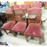 Six 20thC oak slat back dining chairs. Approx. 38" (6). Please Note - we do not make reference to