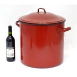 A large red enamel painted cooking pot and cover Please Note - we do not make reference to the