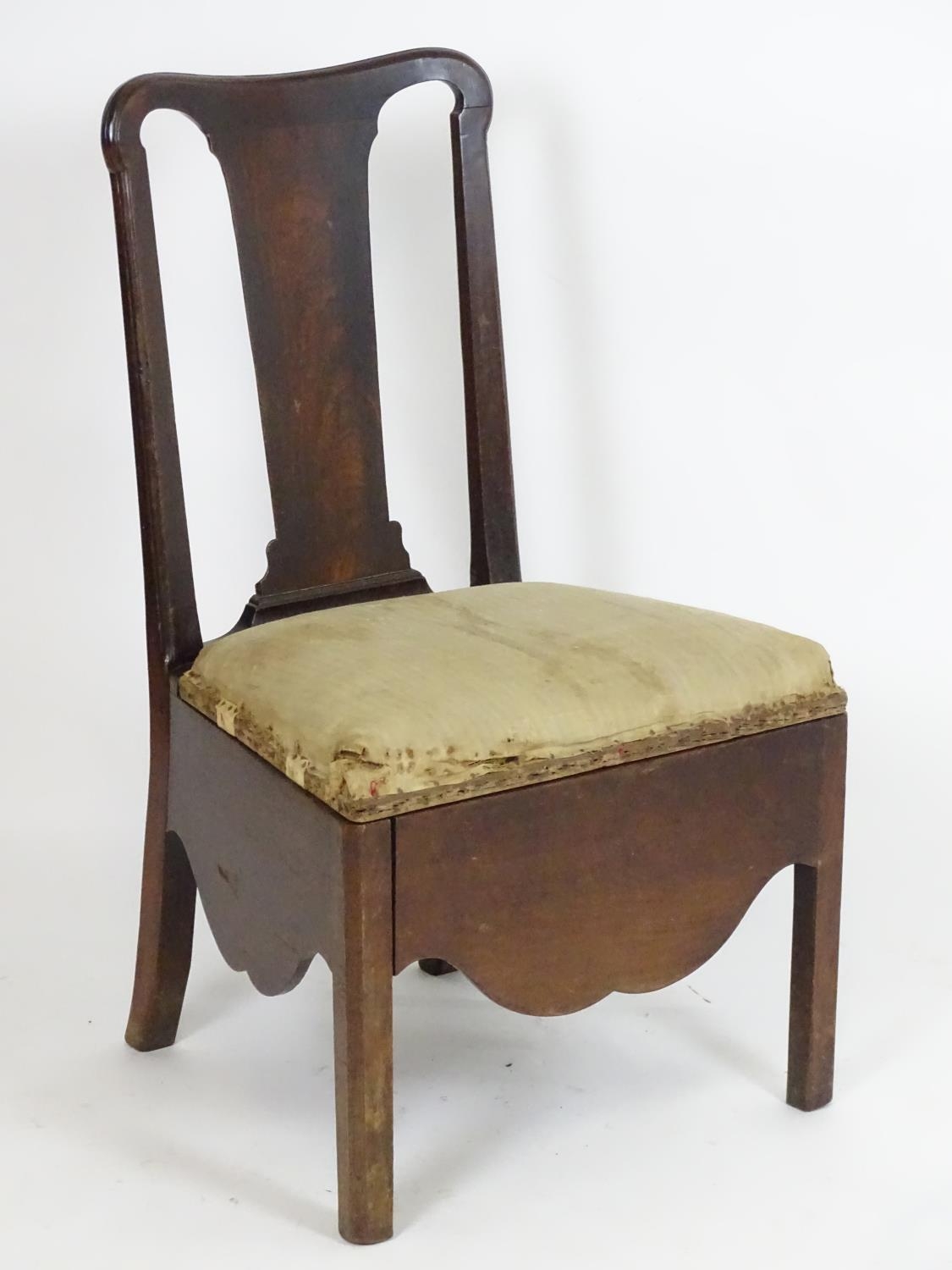 An 18thC mahogany side chair with a shaped top rail, vase shaped back splat and being raised on four