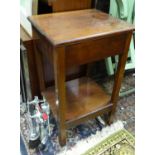A two tier mahogany occasional table Please Note - we do not make reference to the condition of lots