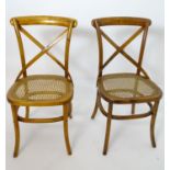 A pair of bentwood and bergere chairs Please Note - we do not make reference to the condition of