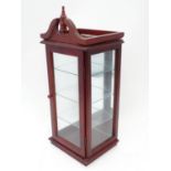 A late 20thC mahogany and glazed display cabinet Please Note - we do not make reference to the