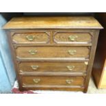 A two over three oak chest of drawers with geometric decoration Please Note - we do not make