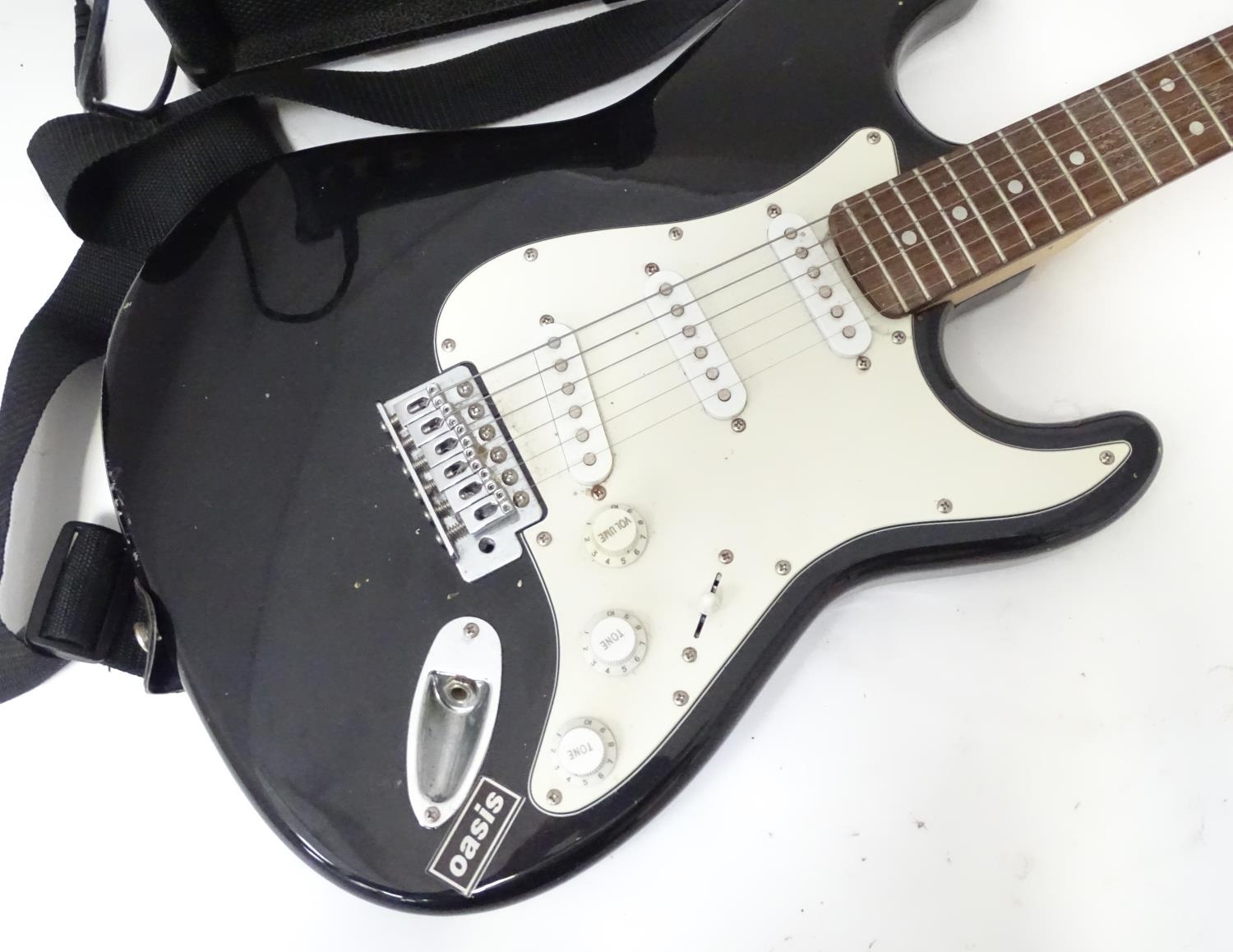 A Burswood stratocaster type guitar with small amplifier, leads, bag, etc. Please Note - we do not - Image 3 of 7