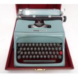 A 20thC Olivetti Studio 44 typewriter, the case with shipping labels Please Note - we do not make