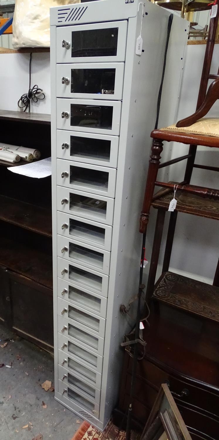 A late 20th / early 21stC metal cabinet by EFG containing 16 separate locking sections Please Note -