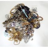 A quantity of assorted costume jewellery to include necklaces, brooches, watches, etc. Please Note -