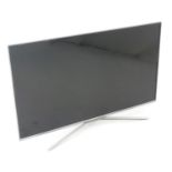 A Samsung flatscreen television / TV Please Note - we do not make reference to the condition of lots