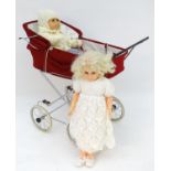 A 20thC dolls pram together with two dolls (3) Please Note - we do not make reference to the